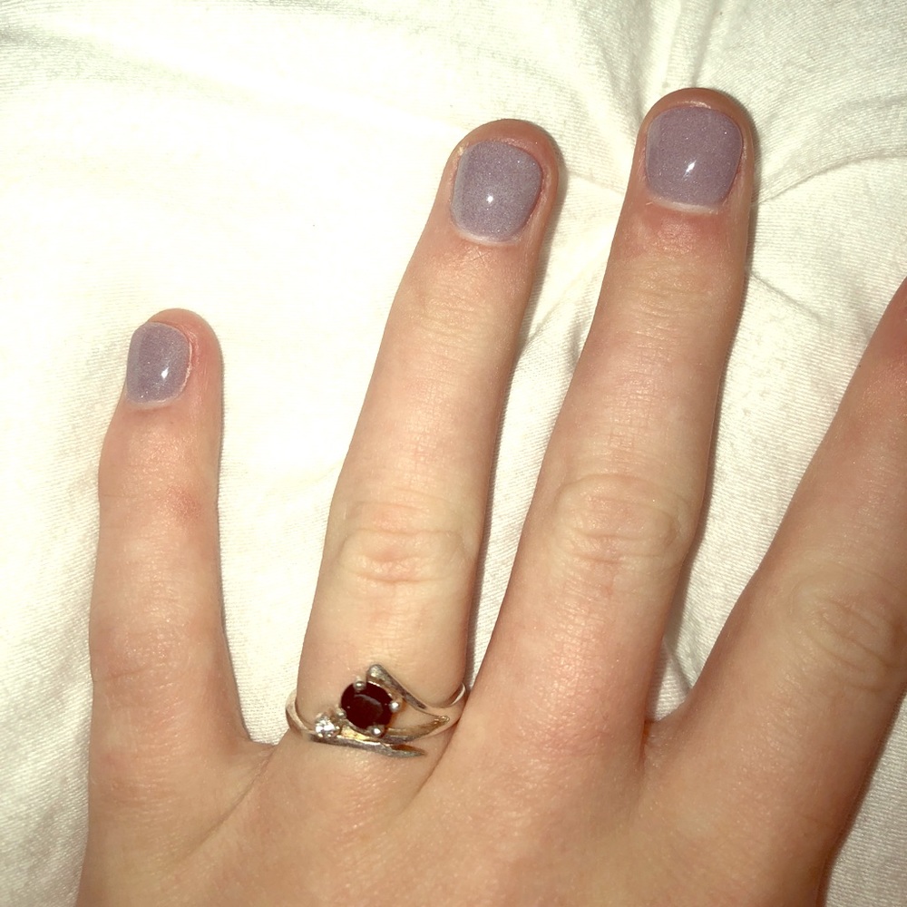 Silver ring with a black and a silver stone